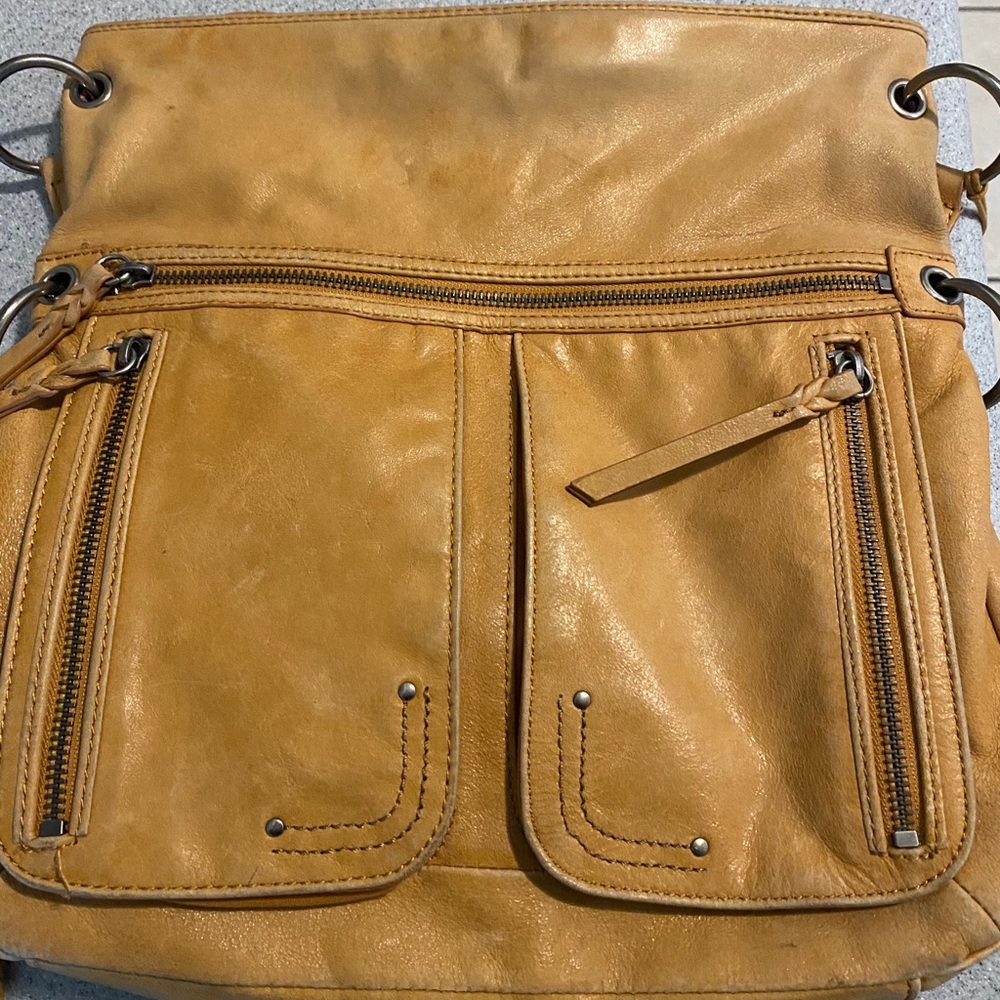 The Sak Crossbody Tan Bag Foldover convertible.